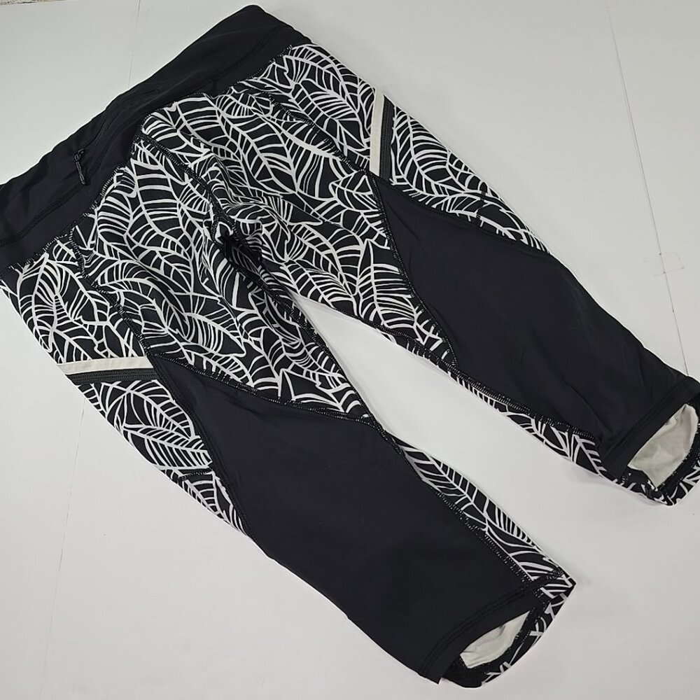 LULULEMON RUN A MARATHON CROP WOMEN'S SIZE 8 PRETTY PALM BLACK ANGEL WING BLACK.